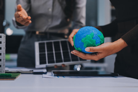 Group of businesspeople in team brainstorm meeting discussion on ESG (Environmental, social, corporate governance) organization planning. Sustainable business, coworker people teamwork. Close upの写真素材