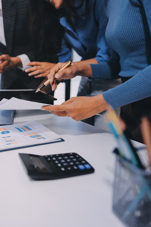 Accounting company provide finance and taxation planning for profitable cash flow, Auditor and accountant team working in office, analyze financial data and accounting record with calculator.Insightの写真素材