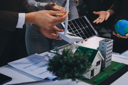 Group of businesspeople in team brainstorm meeting discussion on ESG (Environmental, social, corporate governance) organization planning. Sustainable business, coworker people teamwork. Close upの写真素材