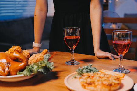 Joyful office Halloween party with coworkers in costumes, celebrating with drinks and laughter, fostering teamwork and festive spiritの写真素材
