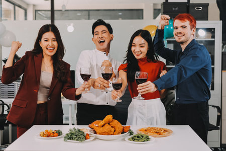 Diversity, dinner and group of people toast celebration together at party. Friends, happy and celebrate with food, wine and friendship for love, support and cheers champagne at business functionの写真素材