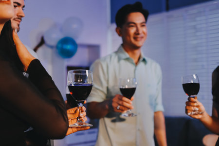 Diversity, dinner and group of people toast celebration together at party. Friends, happy and celebrate with food, wine and friendship for love, support and cheers champagne at business functionの写真素材