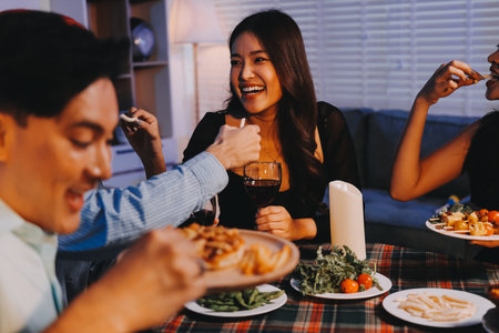 Diversity, dinner and group of people toast celebration together at party. Friends, happy and celebrate with food, wine and friendship for love, support and cheers champagne at business functionの写真素材