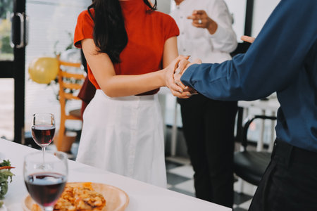 Diversity, dinner and group of people toast celebration together at party. Friends, happy and celebrate with food, wine and friendship for love, support and cheers champagne at business functionの写真素材
