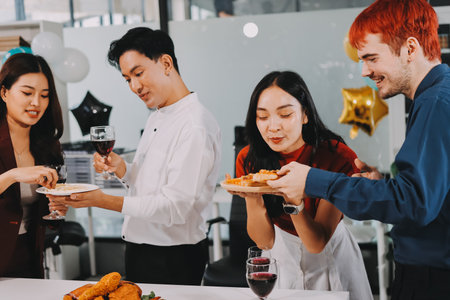 Diversity, dinner and group of people toast celebration together at party. Friends, happy and celebrate with food, wine and friendship for love, support and cheers champagne at business functionの写真素材