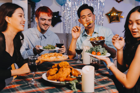 Diversity, dinner and group of people toast celebration together at party. Friends, happy and celebrate with food, wine and friendship for love, support and cheers champagne at business functionの写真素材
