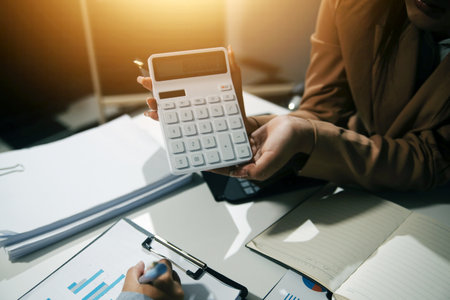 Entrepreneurs and business people conference in modern meeting room, happy multiracial coworkers have fun cooperating working together at office meeting, asian teamwork conceptの写真素材