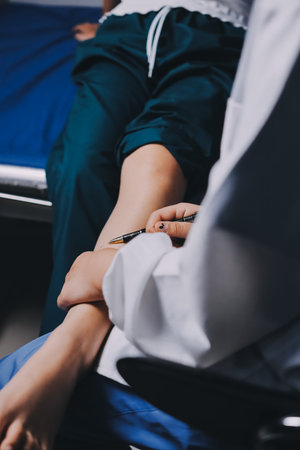 Rehabilitation therapy Professional male physiotherapists working in rehabilitation centers while treating male patients with leg and muscle pain.の写真素材