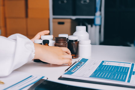 Group of doctors attending seminar in hospital lecture hall with senior physician giving medical presentation and professional training session on healthcare practicesの写真素材