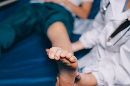 Rehabilitation therapy Professional male physiotherapists working in rehabilitation centers while treating male patients with leg and muscle pain.の写真素材