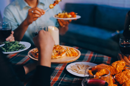 Diversity, dinner and group of people toast celebration together at party. Friends, happy and celebrate with food, wine and friendship for love, support and cheers champagne at business functionの写真素材