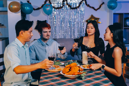 Diversity, dinner and group of people toast celebration together at party. Friends, happy and...