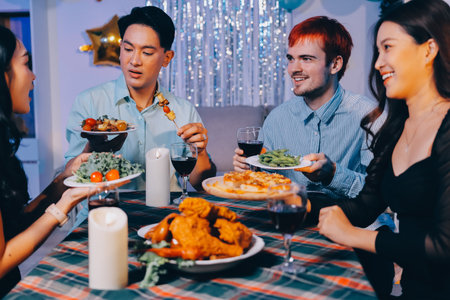 Diversity, dinner and group of people toast celebration together at party. Friends, happy and celebrate with food, wine and friendship for love, support and cheers champagne at business functionの写真素材