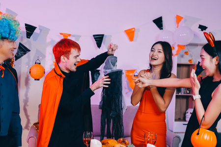 Joyful office Halloween party with coworkers in costumes, celebrating with drinks and laughter, fostering teamwork and festive spiritの写真素材