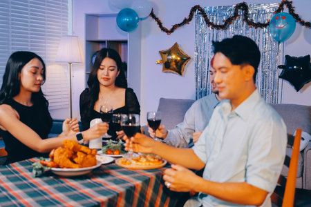 Diversity, dinner and group of people toast celebration together at party. Friends, happy and...