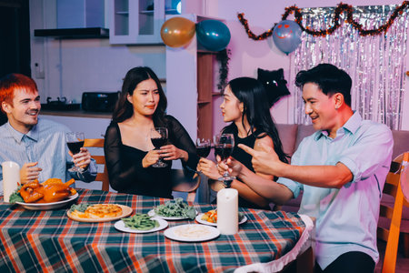 Diversity, dinner and group of people toast celebration together at party. Friends, happy and...