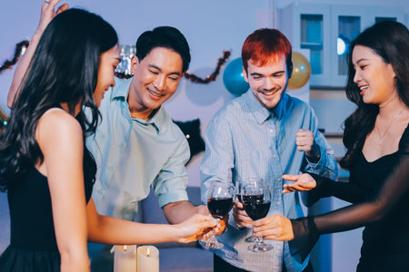 Diversity, dinner and group of people toast celebration together at party. Friends, happy and celebrate with food, wine and friendship for love, support and cheers champagne at business functionの写真素材