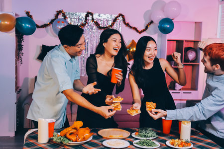 Diversity, dinner and group of people toast celebration together at party. Friends, happy and celebrate with food, wine and friendship for love, support and cheers at business functionの写真素材