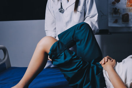 Rehabilitation therapy Professional male physiotherapists working in rehabilitation centers while treating male patients with leg and muscle pain.の写真素材