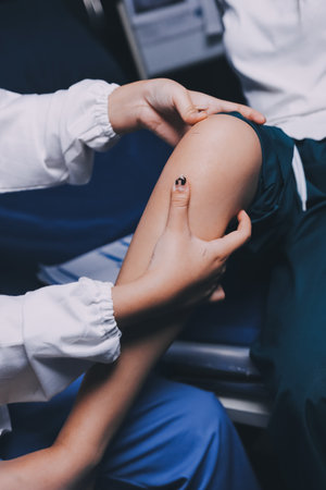 Rehabilitation therapy Professional male physiotherapists working in rehabilitation centers while treating male patients with leg and muscle pain.の写真素材