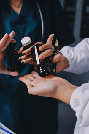 Group of doctors attending seminar in hospital lecture hall with senior physician giving medical presentation and professional training session on healthcare practicesの写真素材