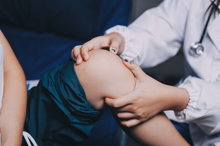 Rehabilitation therapy Professional male physiotherapists working in rehabilitation centers while treating male patients with leg and muscle pain.の写真素材