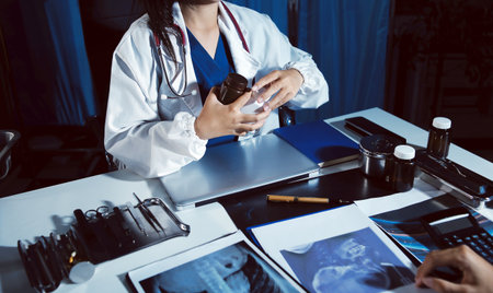 Doctors are meeting at the hospital to discuss treatment options and share experiences with colleagues.の写真素材