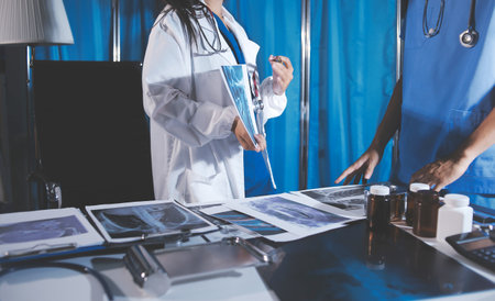 Doctors are meeting at the hospital to discuss treatment options and share experiences with colleagues.の写真素材