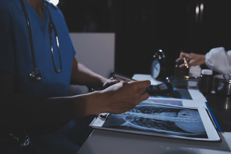 Doctors are meeting at the hospital to discuss treatment options and share experiences with colleagues.の写真素材