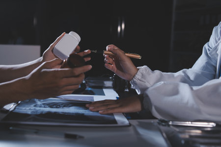 Doctors are meeting at the hospital to discuss treatment options and share experiences with colleagues.の写真素材