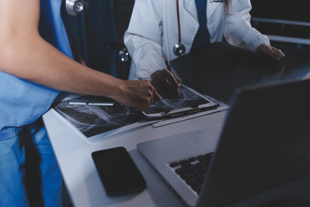 Doctors are meeting at the hospital to discuss treatment options and share experiences with colleagues.の写真素材