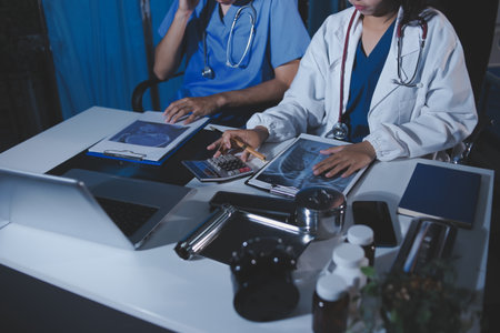 Doctors are meeting at the hospital to discuss treatment options and share experiences with colleagues.の写真素材