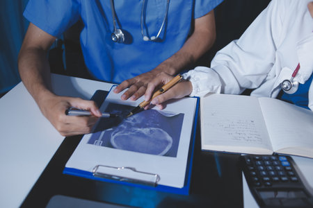 Doctors are meeting at the hospital to discuss treatment options and share experiences with colleagues.の写真素材