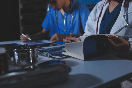 Doctors are meeting at the hospital to discuss treatment options and share experiences with colleagues.の写真素材