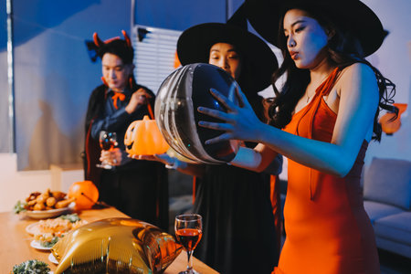 Joyful office Halloween party with coworkers in costumes, celebrating with drinks and laughter, fostering teamwork and festive spiritの写真素材