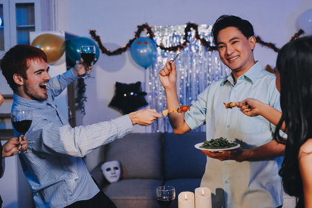 Diversity, dinner and group of people toast celebration together at party. Friends, happy and celebrate with food, wine and friendship for love, support and cheers champagne at business functionの写真素材