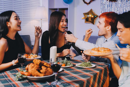 Diversity, dinner and group of people toast celebration together at party. Friends, happy and celebrate with food, wine and friendship for love, support and cheers champagne at business functionの写真素材