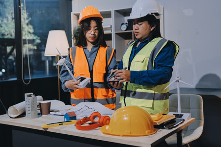 Architects and engineers working collaboratively on construction projectの写真素材