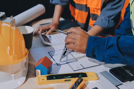 Architects and engineers working collaboratively on construction project