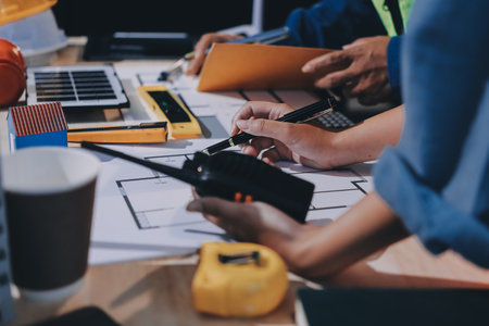 Architects and engineers working collaboratively on construction projectの写真素材