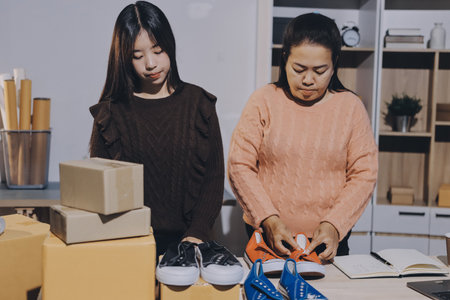 Asian woman selling clothes on camera live broadcast on social network at home, Online selling...
