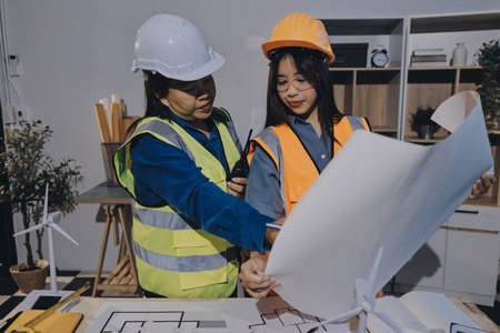 Architects and engineers working collaboratively on construction project