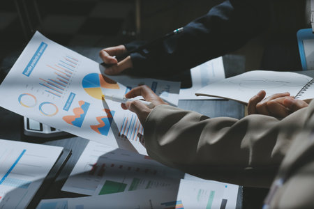 Close up high angle Asian businesswoman working with her coworker in meeting roomの写真素材