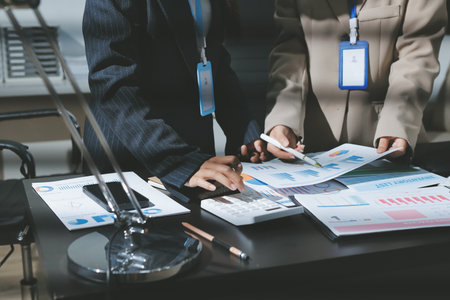 Close up high angle Asian businesswoman working with her coworker in meeting roomの写真素材
