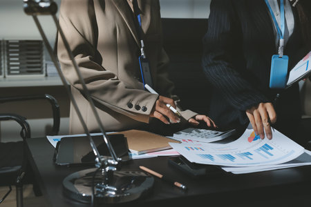 Close up high angle Asian businesswoman working with her coworker in meeting roomの写真素材