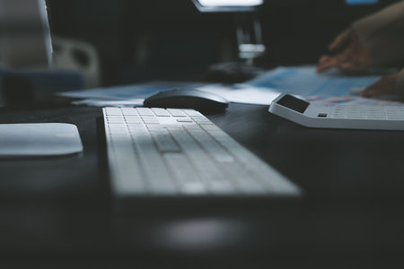 Close up high angle Asian businesswoman working with her coworker in meeting roomの写真素材