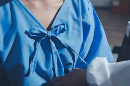 healthy concept; Doctor checking patient's heart with stethoscope at a hospitalの写真素材