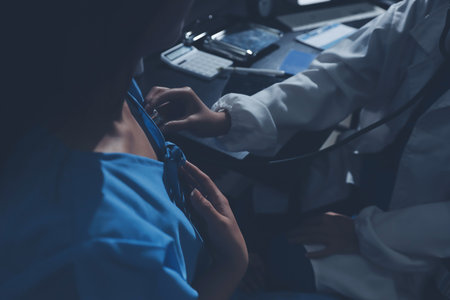 healthy concept; Doctor checking patient's heart with stethoscope at a hospitalの写真素材