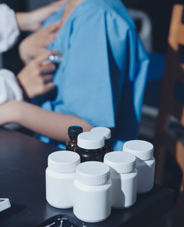 healthy concept; Doctor checking patient's heart with stethoscope at a hospitalの写真素材