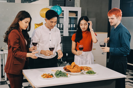 Diversity, dinner and group of people toast celebration together at party. Friends, happy and celebrate with food, wine and friendship for love, support and cheers champagne at business functionの写真素材